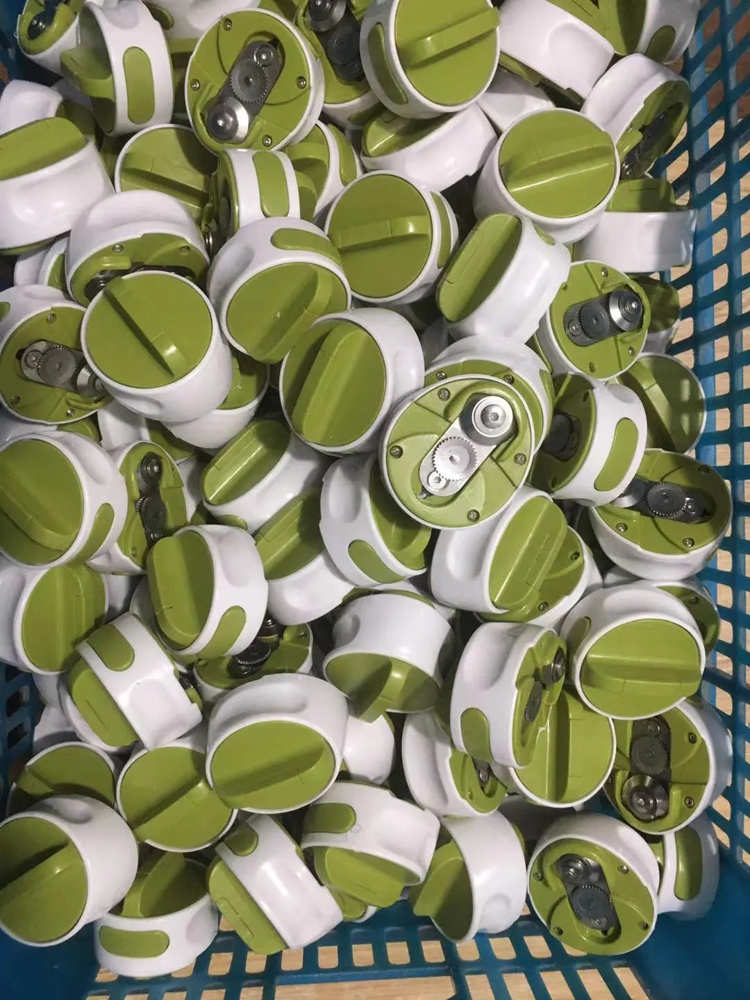 Stainless steel bottle opener with lever mechanism in green colour