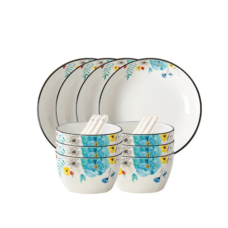 Flower In Ink 22-piece bone china tableware set with floral pattern, bowls, plates, and spoons on a table.