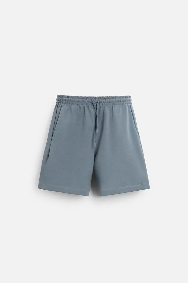 Loose fit short sleeve t-shirt and matching shorts set in blue, shown on a hanger