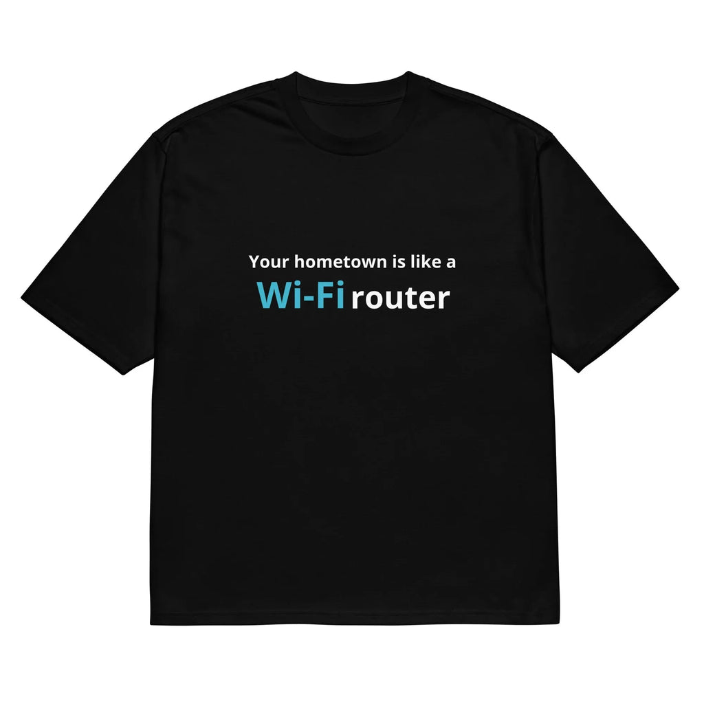 Man wearing a black loose-fit t-shirt with a large 3D digital printed cartoon design on the front.