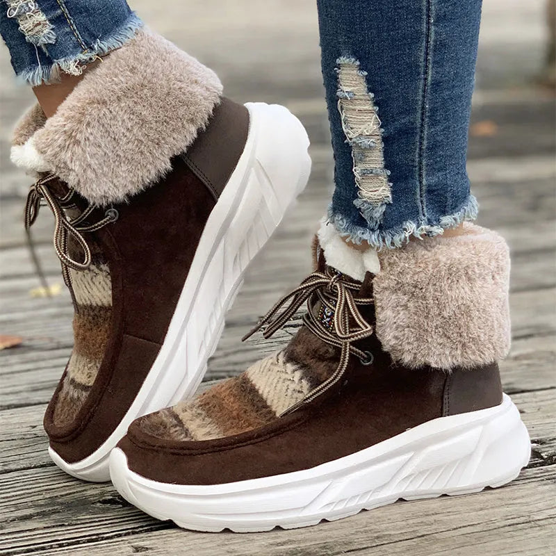 Beige women's lace-up suede snow boots with fuzzy lining and a thick soft sole platform.