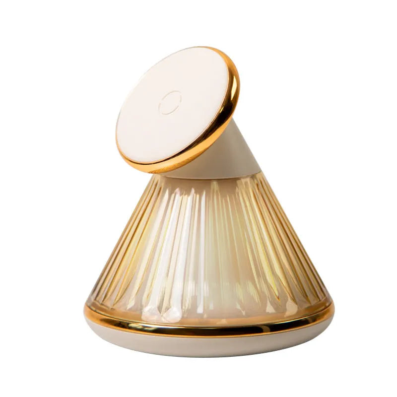 Night table lamp with wireless charging surface in champagne gold metallic finish