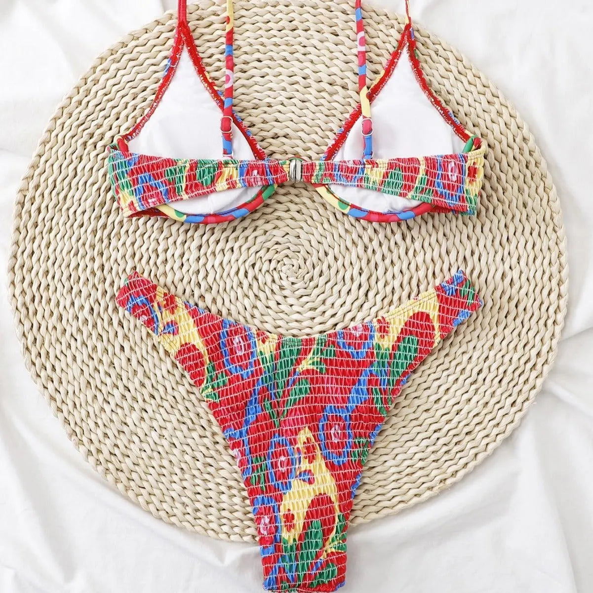 Red floral pattern women's underwire triangle bikini with briefs-style bottom on mannequin