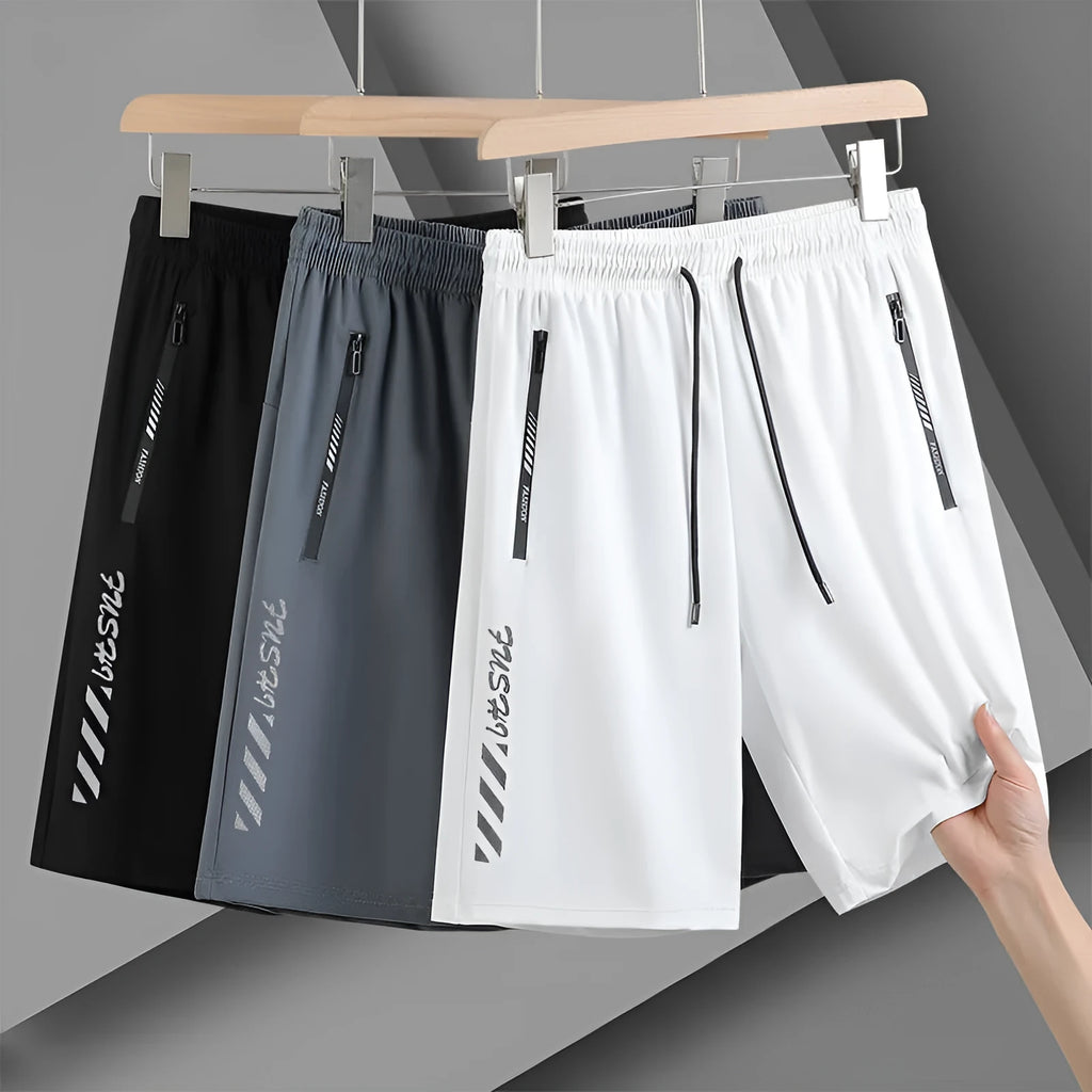 Men's quick-drying nylon sports shorts in loose fit with fifth pants length
