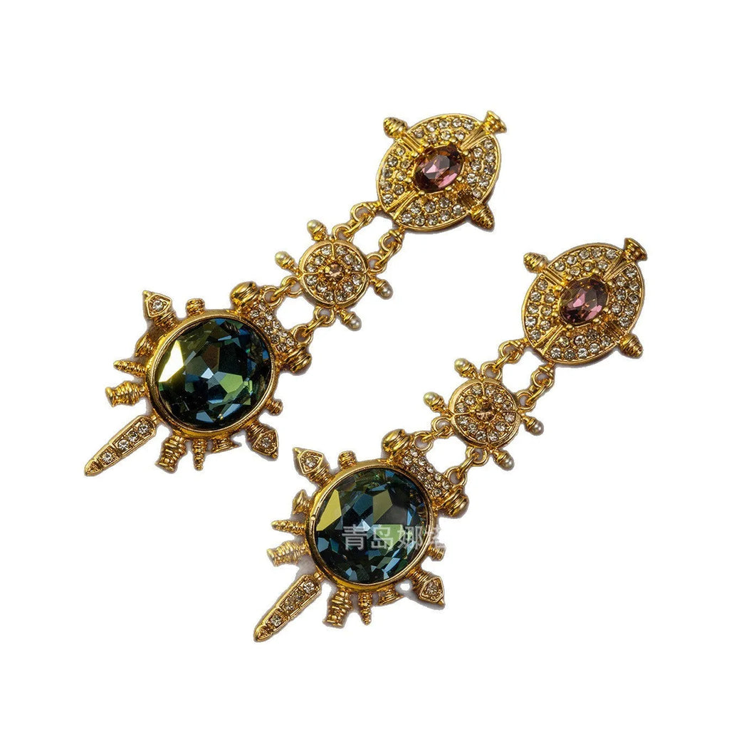 Gold alloy retro geometric round stud earring with diamond finish on white background