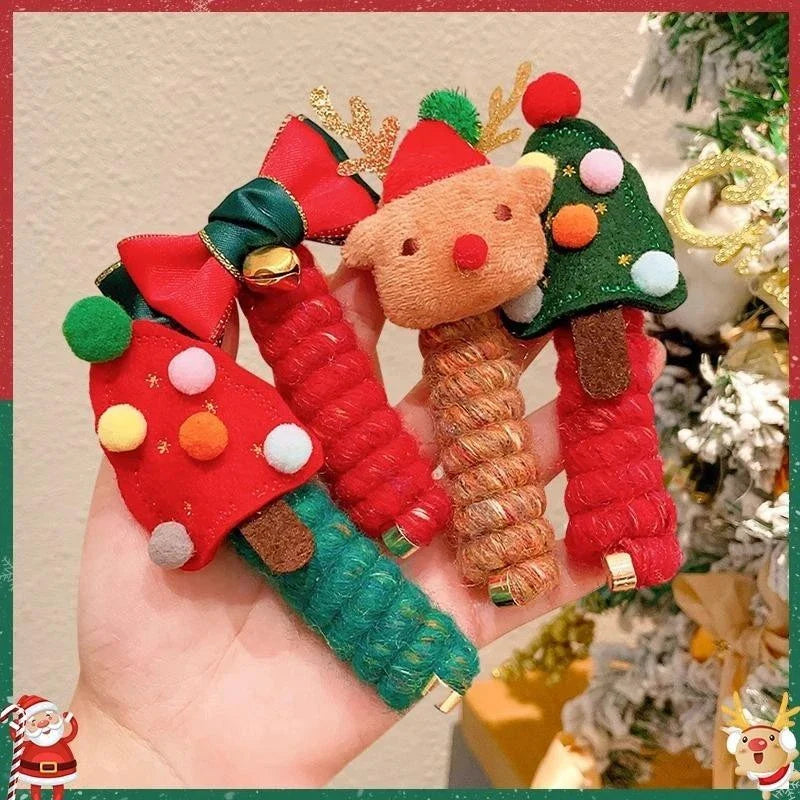 Festive Christmas hair ties for girls in various holiday-themed designs, including red bells, green trees, and khaki deer.