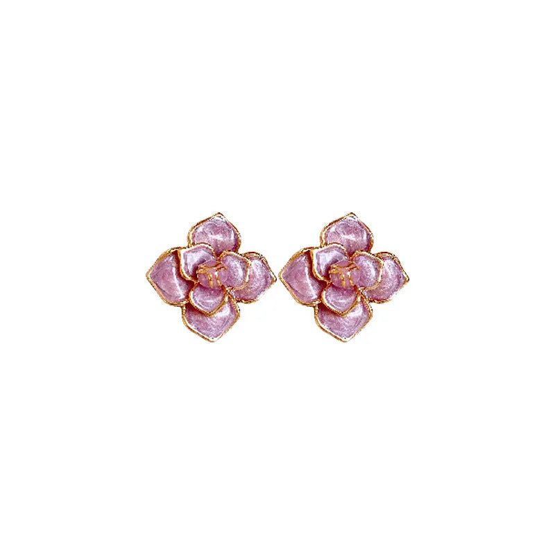 Gold-plated purple oil-spot glaze floral stud earrings on a copper base.