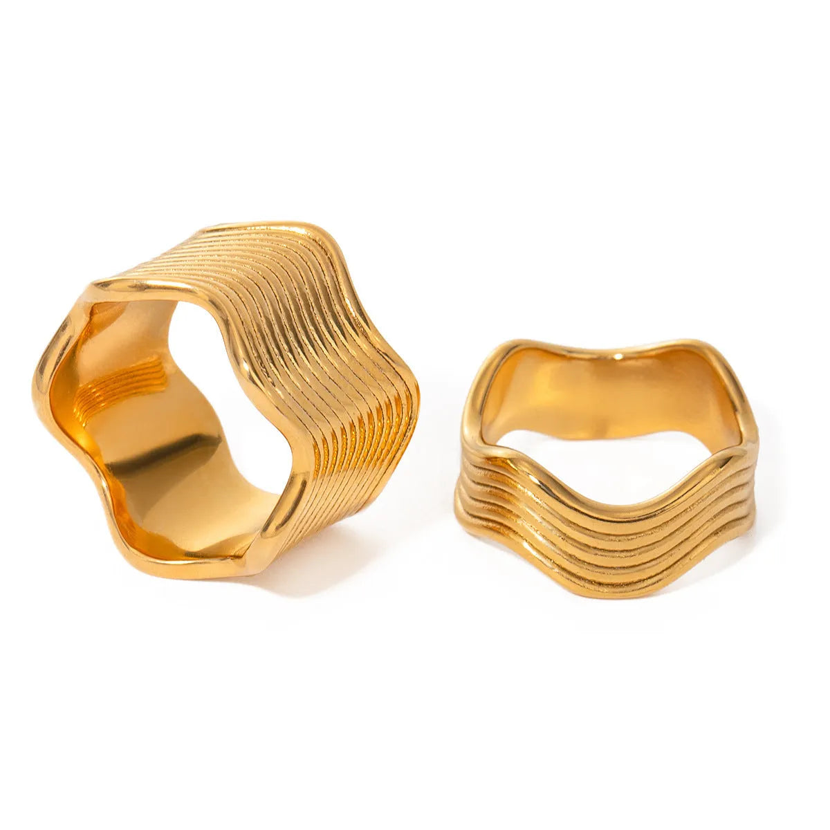 Geometric wave pattern on a stainless steel wide band ring in an electroplated colour finish.
