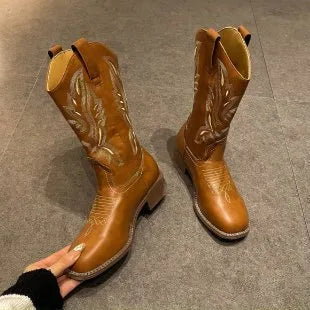 Brown leather women's mid-calf Martin boots with embroidered totem pattern and a waterproof platform sole.