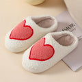 Women's plush home slippers with cartoon love design, round toe, and non-slip PVC sole