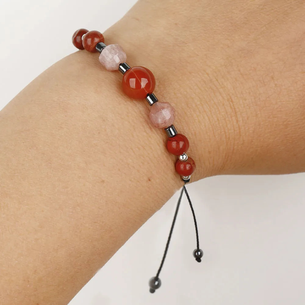 Red manual beaded bracelet with sunstone, redstone and copper geometric beads