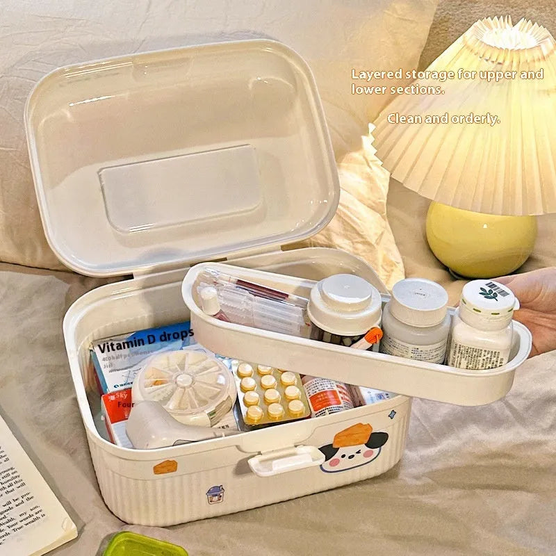 White double-layer plastic storage box with a removable central divider, shown with labelling stickers.