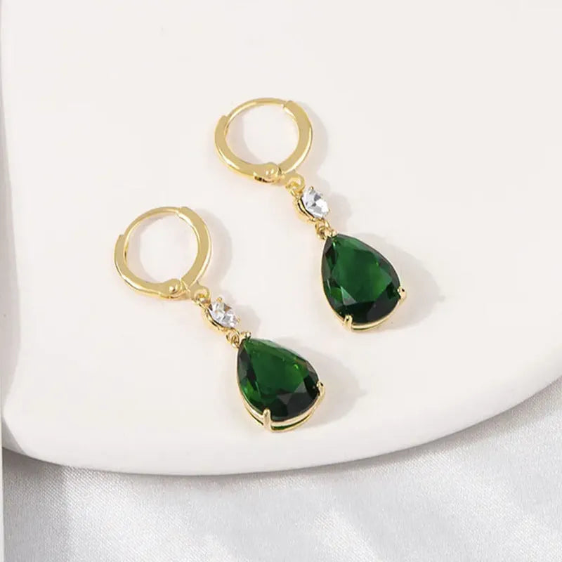 Green geometric teardrop clip-on earrings with gold plating.