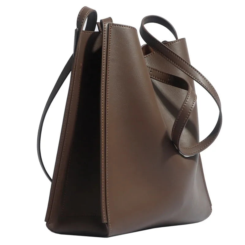 Brown genuine leather women's bucket handbag with double shoulder straps and interior organisation pockets