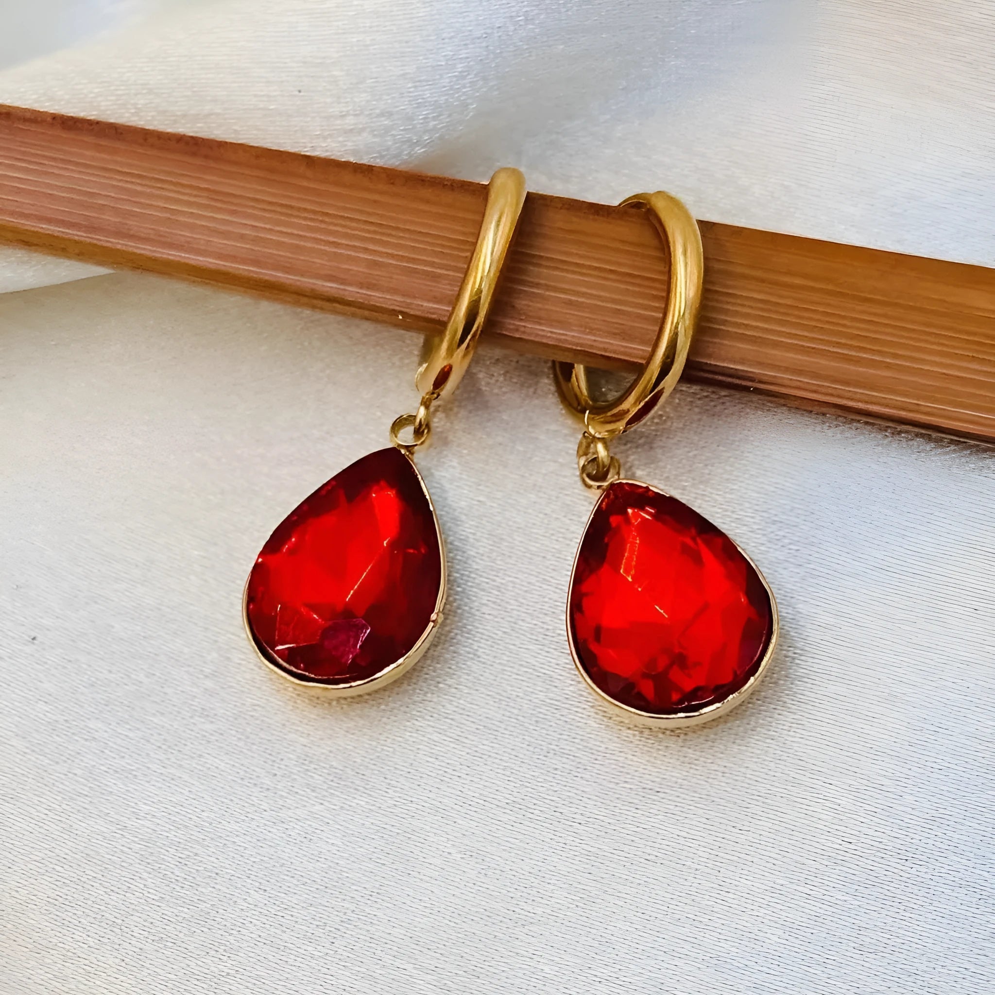 Geometric glass water drop earrings with Saturn design in colourful rare earth options on copper mixed material
