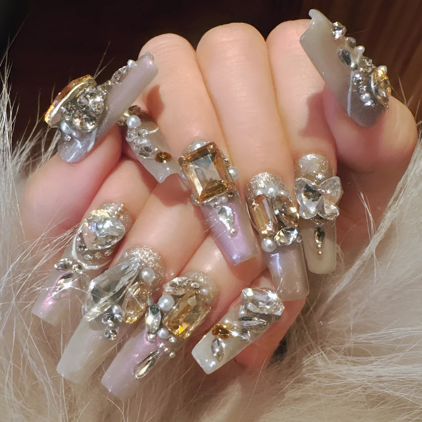 False nail patches with luxury rhinestone designs and phototherapy sealing layer on card packaging