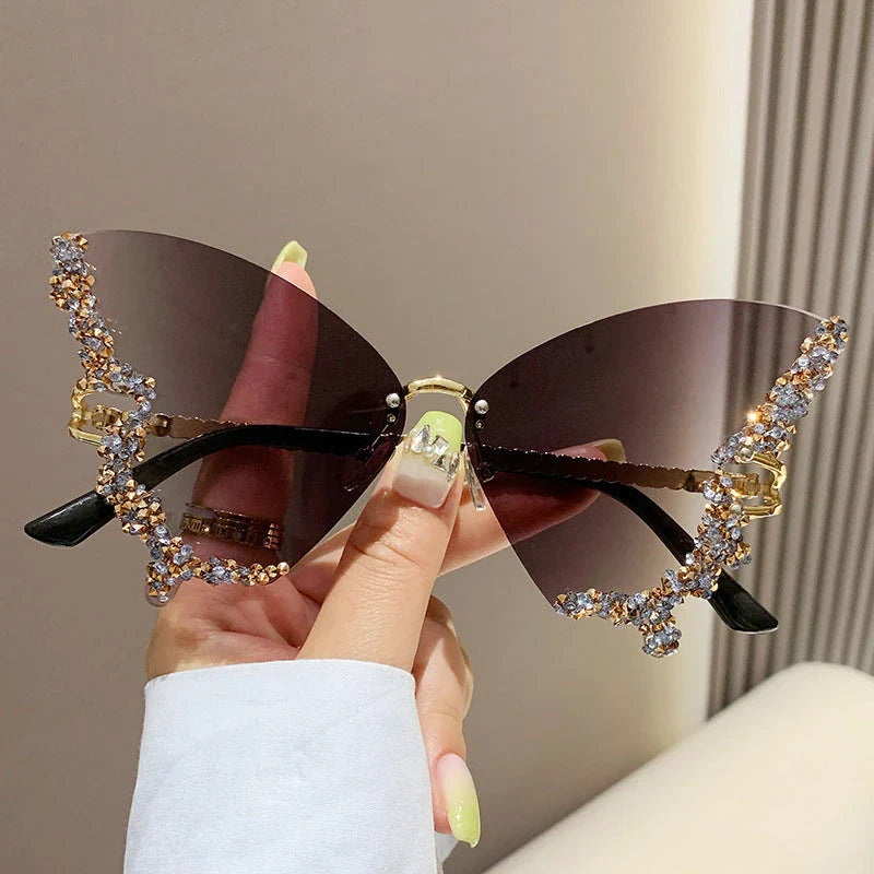Luxury diamond-studded butterfly sunglasses in various gradient color options, featuring a vintage-inspired design and high-quality materials for a fashionable and glamorous look.