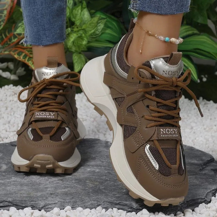 Brown casual clunky sneakers with round toe, lace-up closure, and flat rubber sole on a neutral background