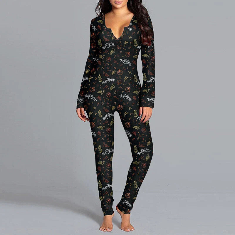 Stylish Halloween-themed pajama jumpsuit with long sleeves and a variety of vibrant prints