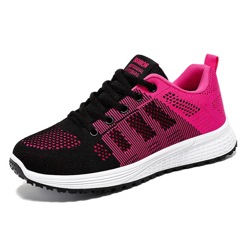 Women's black flyknit casual running shoes with white soft sole and flat heel on a grey background.