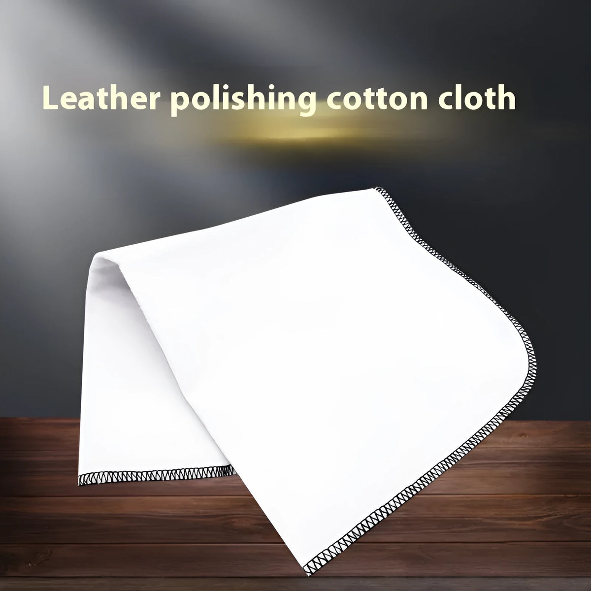 Cotton cleaning and polishing cloth 13 x 50 cm for shoe care, light colour, on a wooden surface