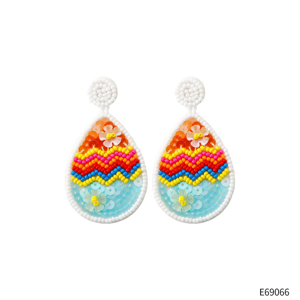Hand-woven beaded drop earrings in geometric Easter egg shape, colour E69066, 6.7cm by 3.7cm