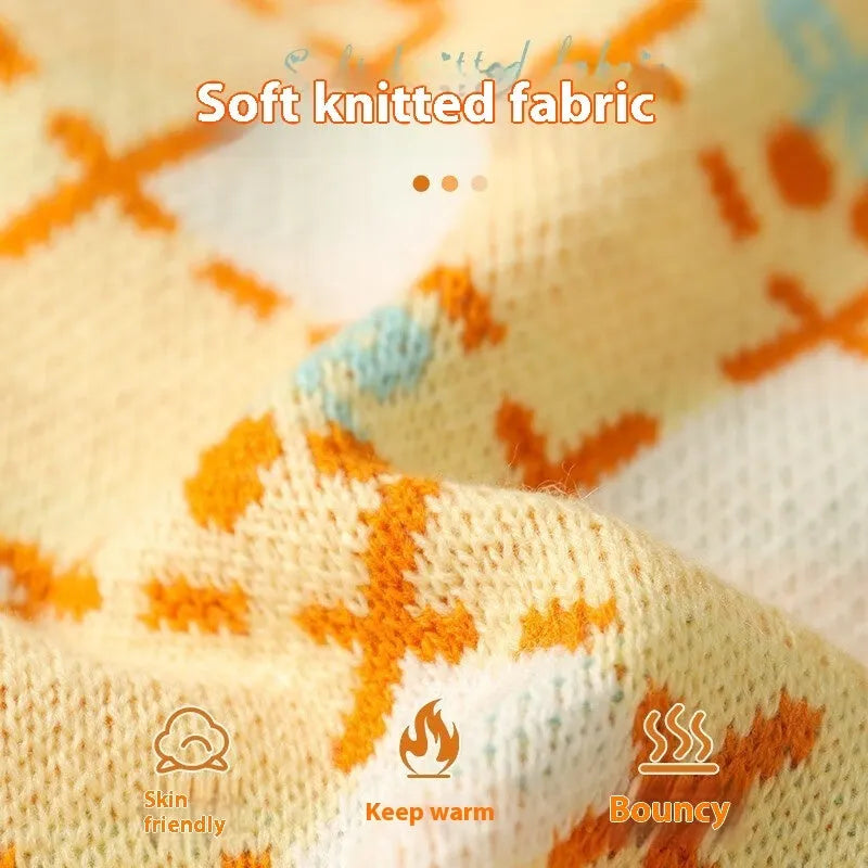 Orange cherry coloured thick knit cat sweater for autumn and winter, shown on a cat.