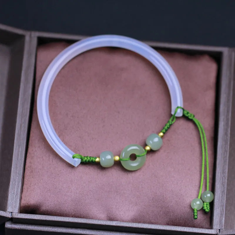 Hand-woven half bracelet with white agate and hetian jade beads and a peace buckle.