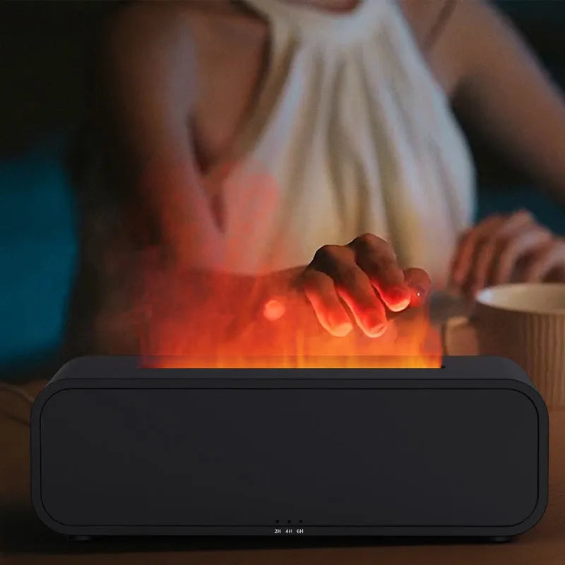 Black and white aroma diffuser with remote control showing colour-changing flame light effect