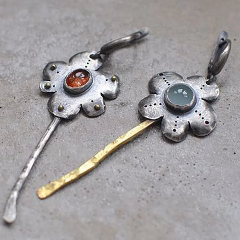 Long geometric flower earrings with retro styling and asymmetric two-colour electroplated finish