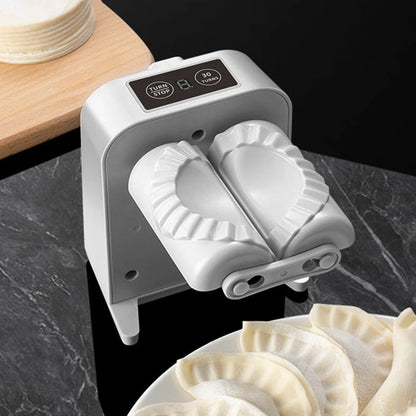 Electric Dumpling Maker Machine on kitchen counter with dumplings