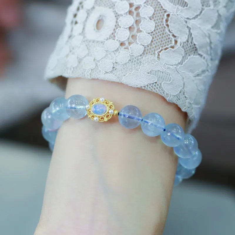 DIY aquamarine bracelet kit with Chinese Fengjiu fox design and pink crystals.