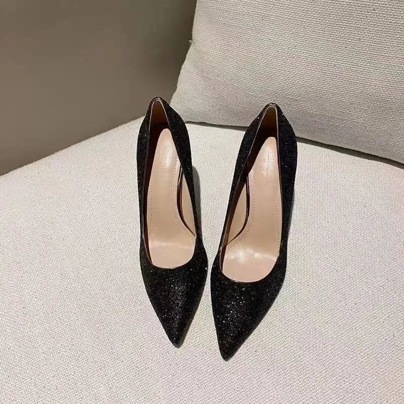 Silver and black women's wedding shoes with crystal details and different heel heights.