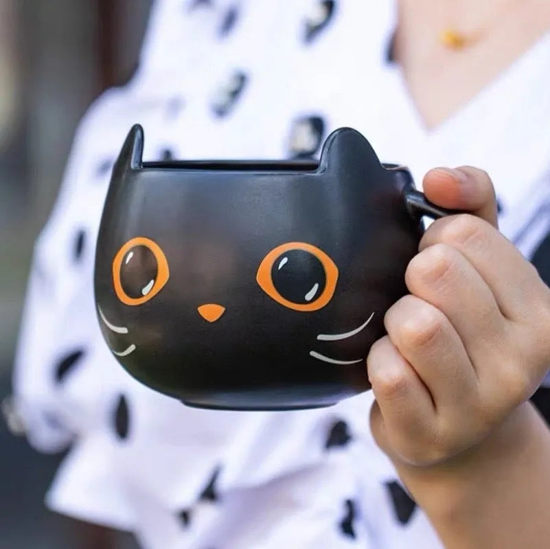 Black ceramic cat-shaped mug with pumpkin spoon couple design, 355ml capacity.