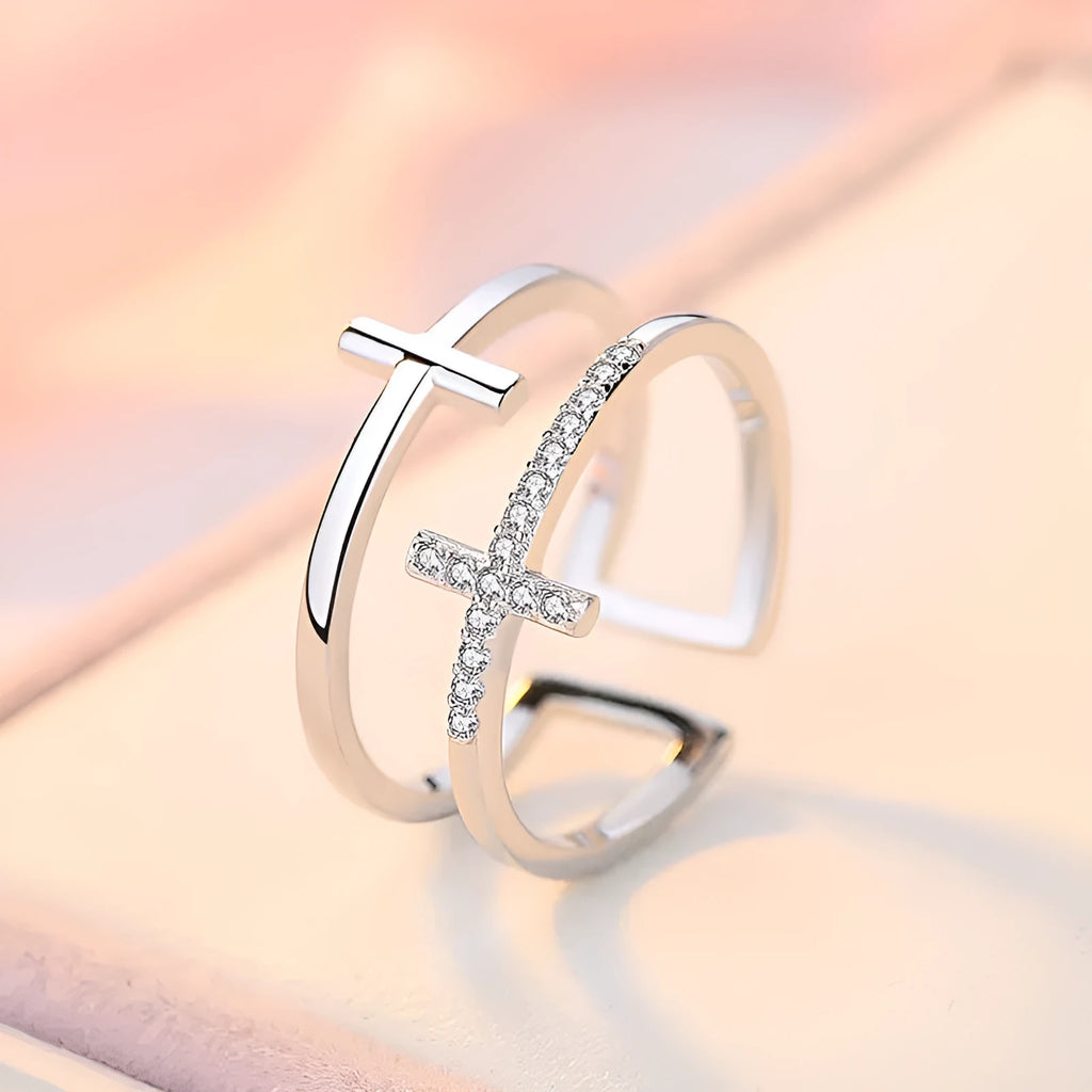 Adjustable double cross geometric ring in copper with sterling silver and zircon stone inlay.