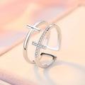Adjustable double cross geometric ring in copper with sterling silver and zircon stone inlay.