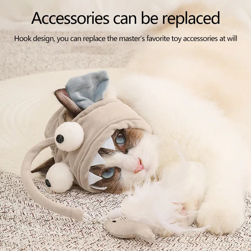 Grey feather head teaser cat stick toy with big eyes, adjustable neckband, shown on a cat.