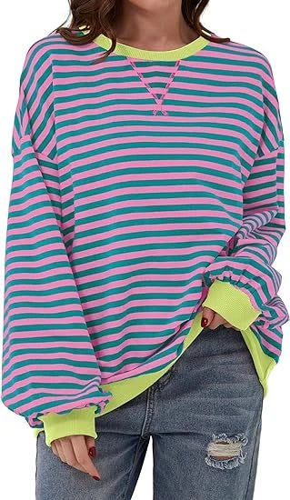 Striped sweatshirt in navy blue, pink, and orange with contrasting colours