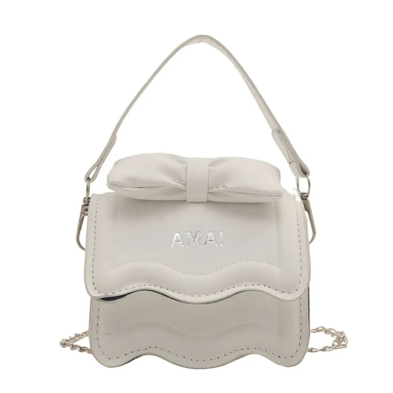 Women's small black PU leather crossbody bag with a single shoulder strap.