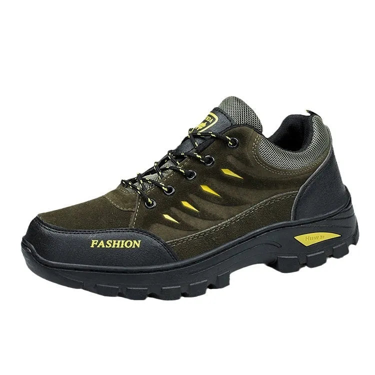 Men's brown suede hiking shoes with rubber sole and lace-up closure, showing round toe and mid-top design