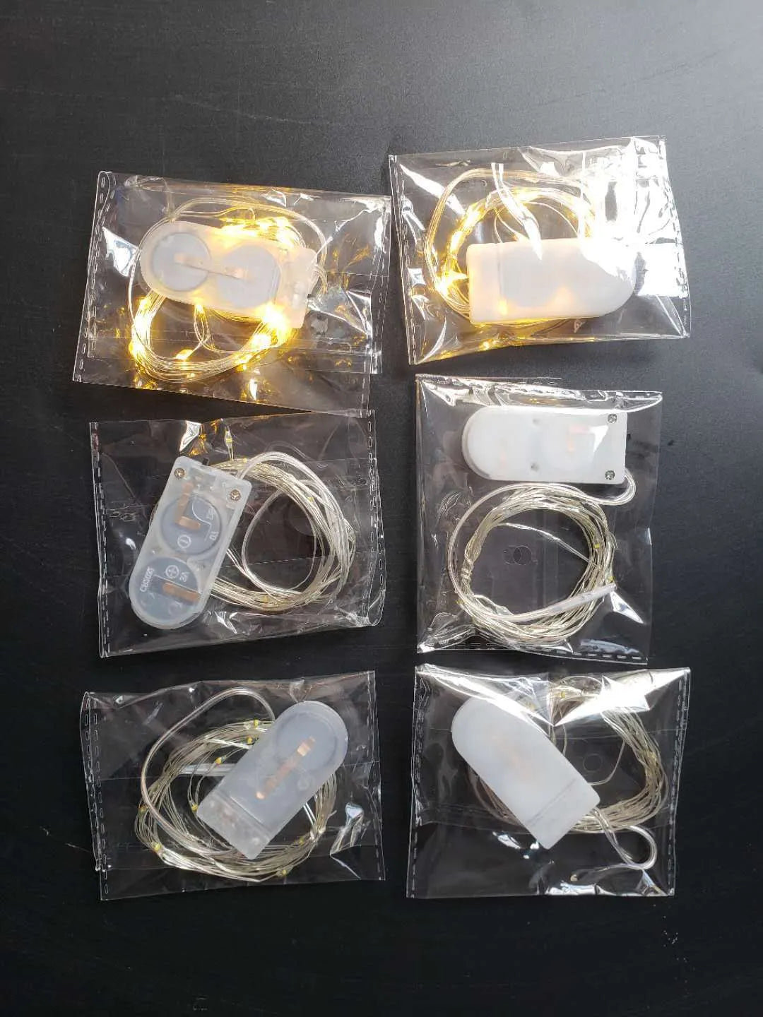 LED button light string with copper wire and battery box showing 20 lights along 2 metre length