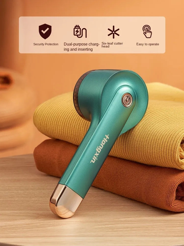 Cordless USB rechargeable hair ball trimmer for removing fluff from clothing and upholstery.