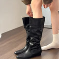 Women's retro square heel knee high boots in beige with pointed toe and hidden height increase