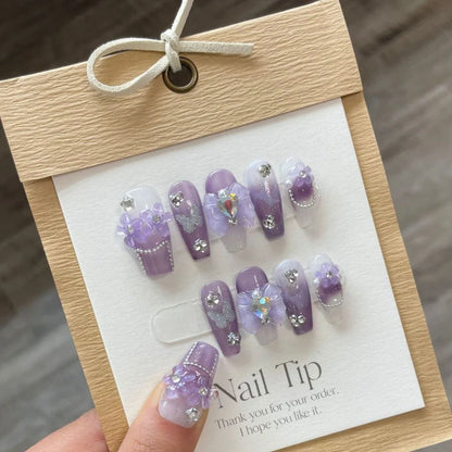 Purple butterfly nail stickers in four sizes with dimensional detailing and adhesive glue