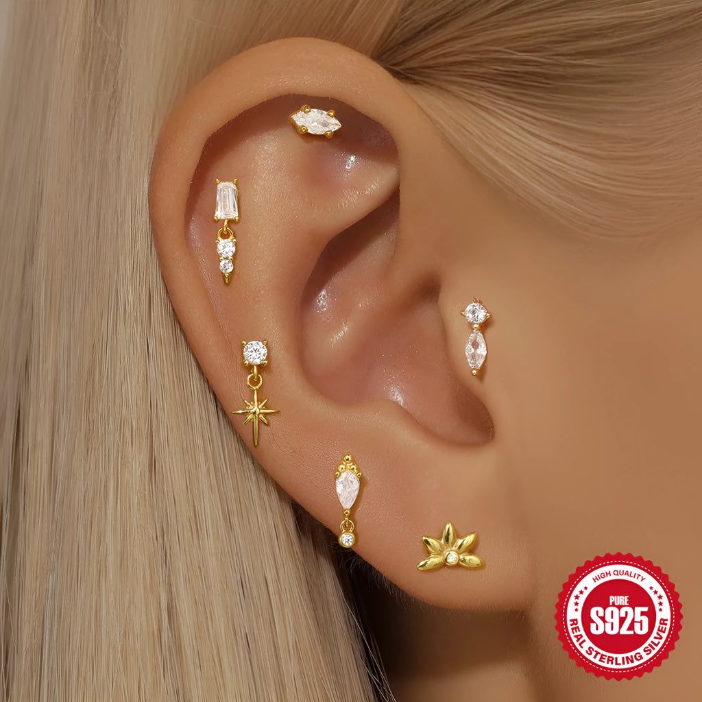 Sterling silver ear stud with a gold electroplated XINGX inlaid tassel design.