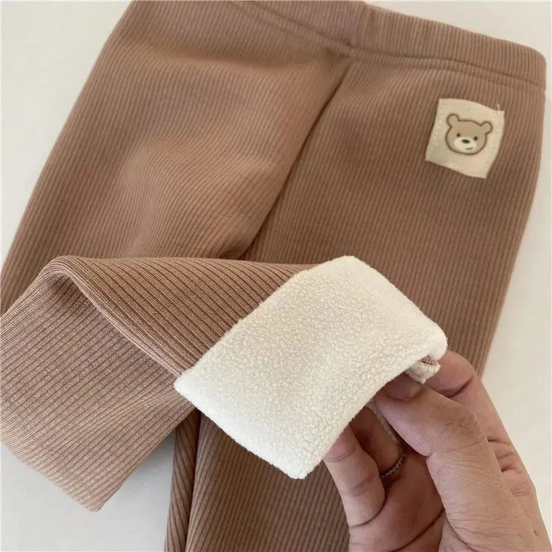 Girls solid colour fleece-lined leggings with high waist and hair band belt, shown in beige, black, brown, grey.