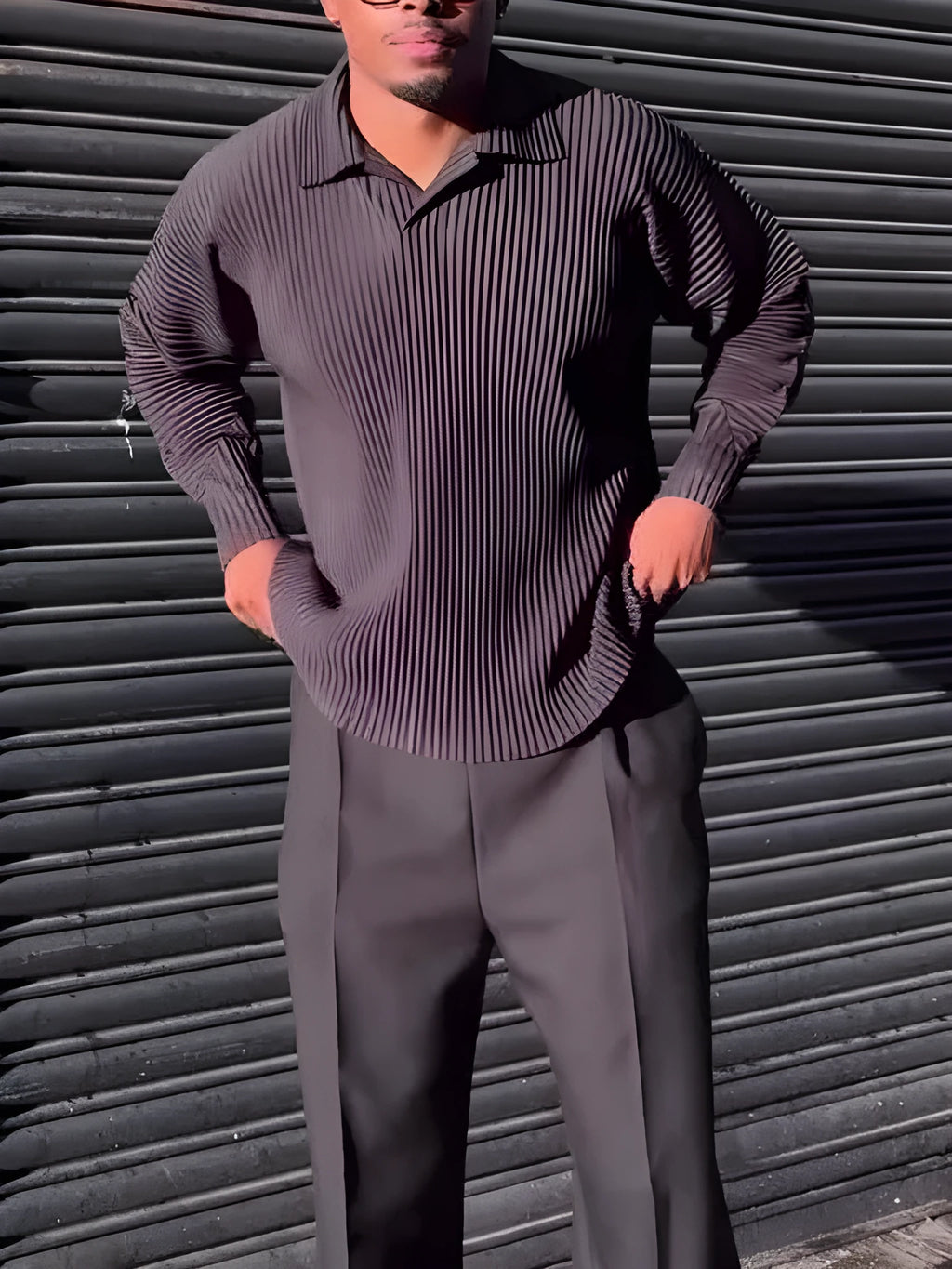 Men's black long-sleeved casual top with a pleated design detail.