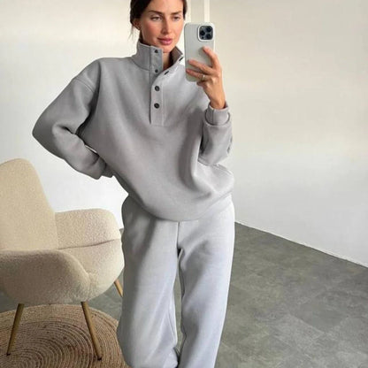 Cozy pullover and pant set in neutral colors, featuring a relaxed, oversized fit and warm hoodie design for ultimate comfort and style.