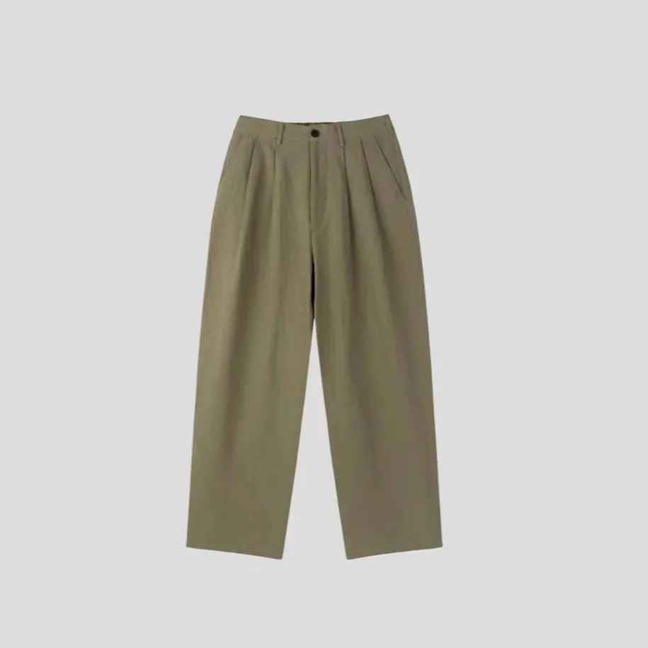 Men's apricot coloured wide-leg cotton linen suit trousers with a loose fit and pencil pants leg opening.