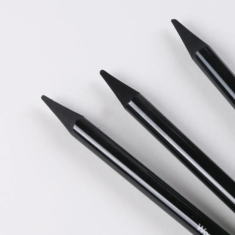 Set of graphite and carbonized drawing pencils with wooden barrels on suction card packaging